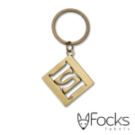 Desperado sleutelhanger, zinklegering met uitgespaard logo, met oog, tussenring en sleutelring, alles in antiek messinglook vernikkeld.
